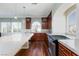 Bright kitchen featuring hardwood floors, stainless steel appliances, and granite countertops at 1009 Ancient Timber Ave, Henderson, NV 89052
