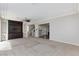 Large living room with built-in entertainment center and staircase at 1009 Ancient Timber Ave, Henderson, NV 89052