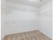 A walk-in closet with carpet and white shelving at 1009 Ancient Timber Ave, Henderson, NV 89052