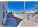 Backyard featuring a concrete patio and privacy wall, offering a peaceful outdoor retreat and quiet enjoyment at 10216 Via Roma Pl, Las Vegas, NV 89144