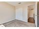 Neutral bedroom featuring a closet with sliding doors and access to the hallway with wood flooring at 10216 Via Roma Pl, Las Vegas, NV 89144