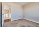 Bedroom featuring neutral carpeting and view of hallway at 10216 Via Roma Pl, Las Vegas, NV 89144