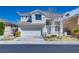 Charming two-story home featuring a two-car garage and well-maintained front yard at 10216 Via Roma Pl, Las Vegas, NV 89144
