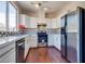 Modern kitchen features stainless steel appliances, white cabinets, and stylish backsplash at 10216 Via Roma Pl, Las Vegas, NV 89144