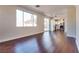 Spacious living room with open floor plan to the kitchen and lots of natural light at 10216 Via Roma Pl, Las Vegas, NV 89144