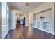 Spacious living room with open floor plan and views of the kitchen and dining area at 10216 Via Roma Pl, Las Vegas, NV 89144