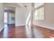 Bright living room features hardwood floors, and window with lots of natural light at 10216 Via Roma Pl, Las Vegas, NV 89144