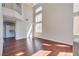 Spacious living room with hardwood floors, tall ceilings, and abundant natural light at 10216 Via Roma Pl, Las Vegas, NV 89144