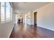 Spacious living room with open floor plan to the kitchen and lots of natural light at 10216 Via Roma Pl, Las Vegas, NV 89144