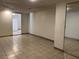 Bedroom with tile flooring, features mirrored closet, and access to the kitchen at 1132 S 10Th St, Las Vegas, NV 89104