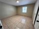 Cozy bedroom with tile flooring, a window and a closet for storage at 1132 S 10Th St, Las Vegas, NV 89104