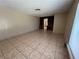 Spacious living room with tile flooring and built-in shelves offers a versatile living space at 1132 S 10Th St, Las Vegas, NV 89104
