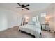 Neutral bedroom featuring carpet, ceiling fan, and windows with blinds at 1328 Graphite Ave, Henderson, NV 89002