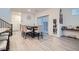Spacious dining room features modern chandelier and easy access to the kitchen and living room at 1328 Graphite Ave, Henderson, NV 89002