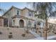 Charming two-story home features a landscaped yard and inviting arched entryway at 1328 Graphite Ave, Henderson, NV 89002
