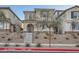 Charming two-story home with a landscaped yard, arched entry, and appealing curb appeal at 1328 Graphite Ave, Henderson, NV 89002