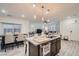 Open-concept kitchen with a large island, modern appliances, and ample counter space at 1328 Graphite Ave, Henderson, NV 89002
