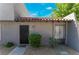 Front exterior showing a well-maintained yard, an inviting entrance, and attractive gray stucco siding at 1340 N Jones Blvd, Las Vegas, NV 89108