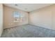 Neutral bedroom features plush carpet and windows providing natural light at 2088 Sawtooth Mountain Dr, Henderson, NV 89044