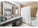 Bathroom with walk in shower and double sinks at 2673 Red Rock St # 102, Las Vegas, NV 89146