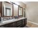 Bathroom featuring double sinks and large mirrors, with a shower at 2673 Red Rock St # 102, Las Vegas, NV 89146