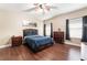 This bedroom has wood floors and lots of natural light at 2673 Red Rock St # 102, Las Vegas, NV 89146