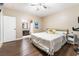Bedroom with private bathroom, ceiling fan, wood floors, and natural light at 2673 Red Rock St # 102, Las Vegas, NV 89146