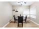 Charming dining area with round glass table and black chairs, illuminated by natural light at 2673 Red Rock St # 102, Las Vegas, NV 89146
