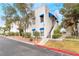 Well-maintained exterior with blue awnings, mature landscaping, and convenient access at 2673 Red Rock St # 102, Las Vegas, NV 89146