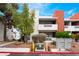 Exterior of home with balconies, green shrubs, and brick accents at 2673 Red Rock St # 102, Las Vegas, NV 89146
