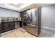 Functional kitchen features stainless steel refrigerator, modern appliances, and dark wood cabinetry at 2673 Red Rock St # 102, Las Vegas, NV 89146