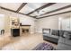 Relaxing living area with a fireplace, a built-in wet bar, and a comfortable sectional sofa at 2673 Red Rock St # 102, Las Vegas, NV 89146
