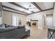 Inviting living room with tile floors, ceiling fan, exposed beams, and a cozy fireplace at 2673 Red Rock St # 102, Las Vegas, NV 89146