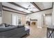 Inviting living room with tile floors, ceiling fan, exposed beams, and a cozy fireplace at 2673 Red Rock St # 102, Las Vegas, NV 89146