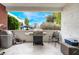 Private patio with BBQ grill and outdoor seating at 2673 Red Rock St # 102, Las Vegas, NV 89146