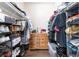 Spacious walk-in closet with shelves and hanging rods, organized for maximum storage at 2673 Red Rock St # 102, Las Vegas, NV 89146