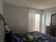 Bedroom with a large bed, bedside tables, and neutral wall color at 3946 Voxna St, Las Vegas, NV 89119