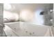 Relaxing bathtub with jets surrounded by clean, modern finishes at 4381 W Flamingo Rd # 2405, Las Vegas, NV 89103