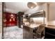 Modern kitchen area showcasing stainless steel appliances, marble flooring, and comfortable seating at 4381 W Flamingo Rd # 2405, Las Vegas, NV 89103
