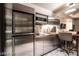Modern kitchen area featuring stainless steel appliances, marble flooring, and sleek design at 4381 W Flamingo Rd # 2405, Las Vegas, NV 89103
