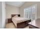 Comfortable bedroom featuring a queen bed, neutral walls, and bright windows with plantation shutters at 5000 Red Rock St # 241, Las Vegas, NV 89118