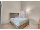 Bedroom featuring a bed, side table, and full size mirror at 5000 Red Rock St # 241, Las Vegas, NV 89118