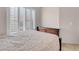 This bedroom features a queen bed, neutral walls, and bright windows with plantation shutters at 5000 Red Rock St # 241, Las Vegas, NV 89118