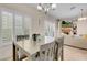 Bright dining area with plantation shutters, blending seamlessly with the adjacent living space at 5000 Red Rock St # 241, Las Vegas, NV 89118