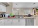 Kitchen featuring granite counters, stainless dishwasher, and ample natural light at 5000 Red Rock St # 241, Las Vegas, NV 89118