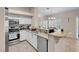 Kitchen with stainless appliances, tile backsplash, and convenient breakfast bar at 5000 Red Rock St # 241, Las Vegas, NV 89118