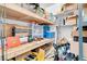 Lots of room for storage with this closet, featuring wooden shelving, boxes, and organizing containers at 5000 Red Rock St # 241, Las Vegas, NV 89118