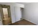 A clean, tidy bedroom leads into a hallway at 510 Holick Ave, Henderson, NV 89011