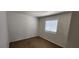 Cozy bedroom with light walls, tiled floors, and window at 510 Holick Ave, Henderson, NV 89011