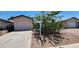 Charming single-story home featuring a private garage and a well-maintained front yard with mature landscaping at 510 Holick Ave, Henderson, NV 89011